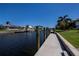 Backyard view of a dock, boat lift and the canal at 1230 Royal Tern Dr, Punta Gorda, FL 33950