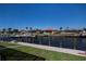 Backyard view featuring a dock, canal and neighboring waterfront homes at 1230 Royal Tern Dr, Punta Gorda, FL 33950