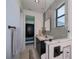 Well-designed bathroom featuring a marble vanity, sleek black hardware, and a modern design at 1230 Royal Tern Dr, Punta Gorda, FL 33950
