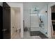 Modern bathroom with a sleek glass shower enclosure, rainfall showerhead, and elegant tiling at 1230 Royal Tern Dr, Punta Gorda, FL 33950