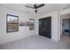 Bedroom featuring a ceiling fan and a large closet at 1230 Royal Tern Dr, Punta Gorda, FL 33950