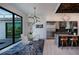 Bright dining area next to a modern kitchen and overlooks a pool at 1230 Royal Tern Dr, Punta Gorda, FL 33950