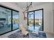 Modern dining room with natural light, pool view and contemporary furnishings at 1230 Royal Tern Dr, Punta Gorda, FL 33950