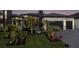 Beautifully landscaped modern home with a well-manicured lawn and vibrant tropical plants at 1230 Royal Tern Dr, Punta Gorda, FL 33950
