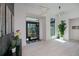 Elegant foyer with high ceilings, decorative lighting, and a clear view through the glass front door at 1230 Royal Tern Dr, Punta Gorda, FL 33950