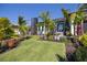 Luxurious landscaping surrounds this home, highlighting a modern exterior at 1230 Royal Tern Dr, Punta Gorda, FL 33950