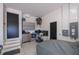 Garage featuring storage cabinets, tools, and a covered vehicle, providing ample space at 1230 Royal Tern Dr, Punta Gorda, FL 33950