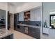 Kitchen wet bar area features custom cabinets, a beverage fridge, and modern fixtures at 1230 Royal Tern Dr, Punta Gorda, FL 33950