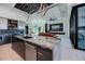 Open-concept kitchen featuring an island, modern appliances, and seamless flow to living area at 1230 Royal Tern Dr, Punta Gorda, FL 33950