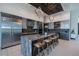 Modern kitchen with large island, stainless steel appliances, and adjacent dining area at 1230 Royal Tern Dr, Punta Gorda, FL 33950