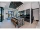 Bright kitchen with large island, modern cabinetry, stainless steel appliances, and access to the outdoors at 1230 Royal Tern Dr, Punta Gorda, FL 33950