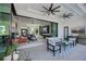 Inviting outdoor living space with multiple ceiling fans and a view of the living room at 1230 Royal Tern Dr, Punta Gorda, FL 33950