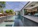 Beautiful in-ground pool surrounded by lush landscaping and offering a relaxing oasis at 1230 Royal Tern Dr, Punta Gorda, FL 33950