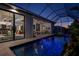 Stunning indoor/outdoor living with pool, outdoor kitchen, and seamless access to interior spaces at 1230 Royal Tern Dr, Punta Gorda, FL 33950