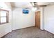 Bedroom featuring a ceiling fan, carpeted floors, a window, and light-colored walls at 16249 Ashland Ave, Port Charlotte, FL 33954