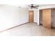 Bedroom with a ceiling fan, wood flooring, closet with sliding doors, and light-colored walls at 16249 Ashland Ave, Port Charlotte, FL 33954