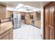 The kitchen features light wood cabinets, stainless steel appliances, and tile flooring at 16249 Ashland Ave, Port Charlotte, FL 33954