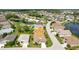 Aerial view of home in a golf community with well-maintained landscaping and beautiful surroundings at 1701 Lastingham Ln, Port Charlotte, FL 33980