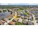 Aerial view of home near a pond, golf course, and lush landscaping in a gated community at 1701 Lastingham Ln, Port Charlotte, FL 33980