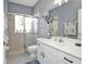 Updated bathroom featuring a double sink vanity, walk-in shower, and modern fixtures at 1701 Lastingham Ln, Port Charlotte, FL 33980