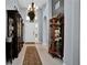 Elegant foyer with high ceilings, tile flooring, and stylish decor at 1701 Lastingham Ln, Port Charlotte, FL 33980