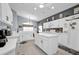 Modern kitchen with white cabinetry, stainless steel appliances, and a center island at 1701 Lastingham Ln, Port Charlotte, FL 33980