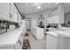 Bright kitchen with an island, lots of storage, and a view of the dining area at 1701 Lastingham Ln, Port Charlotte, FL 33980