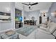 Open-concept living area with tile floors, modern furnishings, and an adjacent dining area at 1701 Lastingham Ln, Port Charlotte, FL 33980