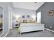 Bright main bedroom with a neutral color scheme, carpet flooring, and two windows at 1701 Lastingham Ln, Port Charlotte, FL 33980
