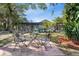 The backyard has a patio with outside seating that overlooks the pool at 17380 Shirley Ave, Port Charlotte, FL 33948
