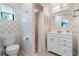 Well-lit bathroom with white vanity, tiled shower, and a clean, classic design at 17380 Shirley Ave, Port Charlotte, FL 33948