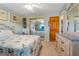 Bright bedroom with neutral walls, a starfish-themed bedspread, and sliding door closet at 17380 Shirley Ave, Port Charlotte, FL 33948