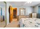 Bright bedroom offering a glimpse into the en suite bathroom, enhancing convenience at 17380 Shirley Ave, Port Charlotte, FL 33948
