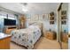 Bright bedroom with neutral walls, a starfish-themed bedspread, and ample closet space at 17380 Shirley Ave, Port Charlotte, FL 33948