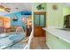 Dining area with access to the kitchen and view of the adjacent living spaces at 17380 Shirley Ave, Port Charlotte, FL 33948