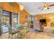 Bright open-concept living and dining area with tile flooring, perfect for entertaining and relaxation at 17380 Shirley Ave, Port Charlotte, FL 33948