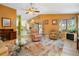 Inviting living room with tile flooring, ceiling fan, and access to the patio at 17380 Shirley Ave, Port Charlotte, FL 33948