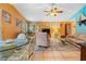 Open-concept living and dining area with ceramic tile flooring and abundant natural light at 17380 Shirley Ave, Port Charlotte, FL 33948