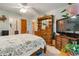 Spacious main bedroom featuring carpet flooring and wooden furniture at 17380 Shirley Ave, Port Charlotte, FL 33948