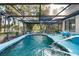 Sparkling pool enclosed within a screened lanai, providing a serene and private oasis at 17380 Shirley Ave, Port Charlotte, FL 33948