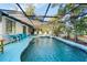 A view of the enclosed in ground pool at 17380 Shirley Ave, Port Charlotte, FL 33948