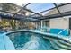 Enclosed swimming pool surrounded by a spacious patio, and seating at 17380 Shirley Ave, Port Charlotte, FL 33948