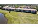 Aerial view of multi-story condo building in a community setting with lush green landscaping at 175 Kings Hwy # 736, Punta Gorda, FL 33983