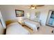Well-lit bedroom featuring neutral walls, a ceiling fan, and tiled floors at 175 Kings Hwy # 736, Punta Gorda, FL 33983