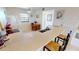 Kitchen bar area with seating and appliances, next to a dining table at 175 Kings Hwy # 736, Punta Gorda, FL 33983