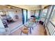 Enclosed lanai with seating and views of the living space and main bedroom at 175 Kings Hwy # 736, Punta Gorda, FL 33983