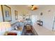Bright and airy living room with tile floors that flows into the dining room and kitchen at 175 Kings Hwy # 736, Punta Gorda, FL 33983