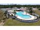 Aerial view of a large community pool and surrounding recreational areas, with ample seating at 175 Kings Hwy # 736, Punta Gorda, FL 33983