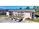 Aerial shot of building with balconies, easy parking, and tidy landscaping enhancing curb appeal at 179 Boundary Blvd # 4, Rotonda West, FL 33947