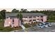 Exterior view of building with multiple units, showcasing balconies, and convenient parking at 179 Boundary Blvd # 4, Rotonda West, FL 33947